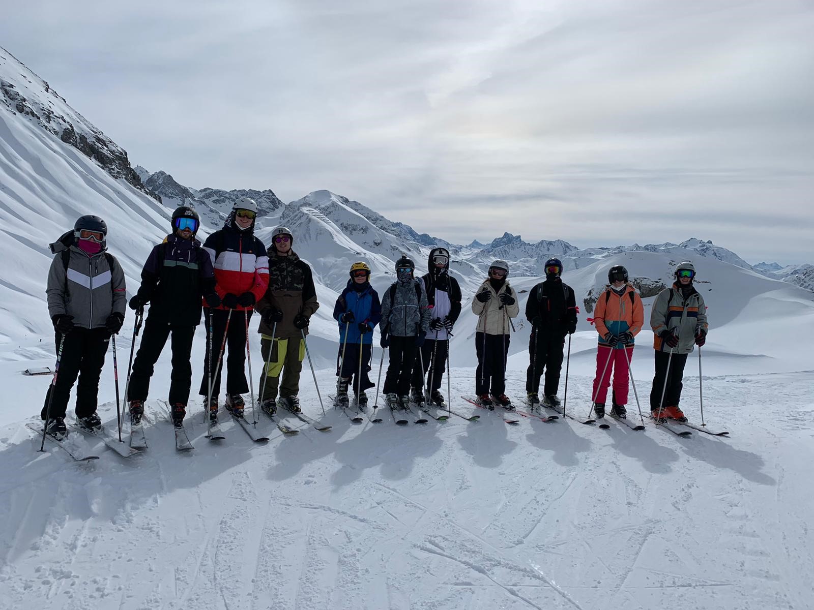 Students and staff lined up on the slopes